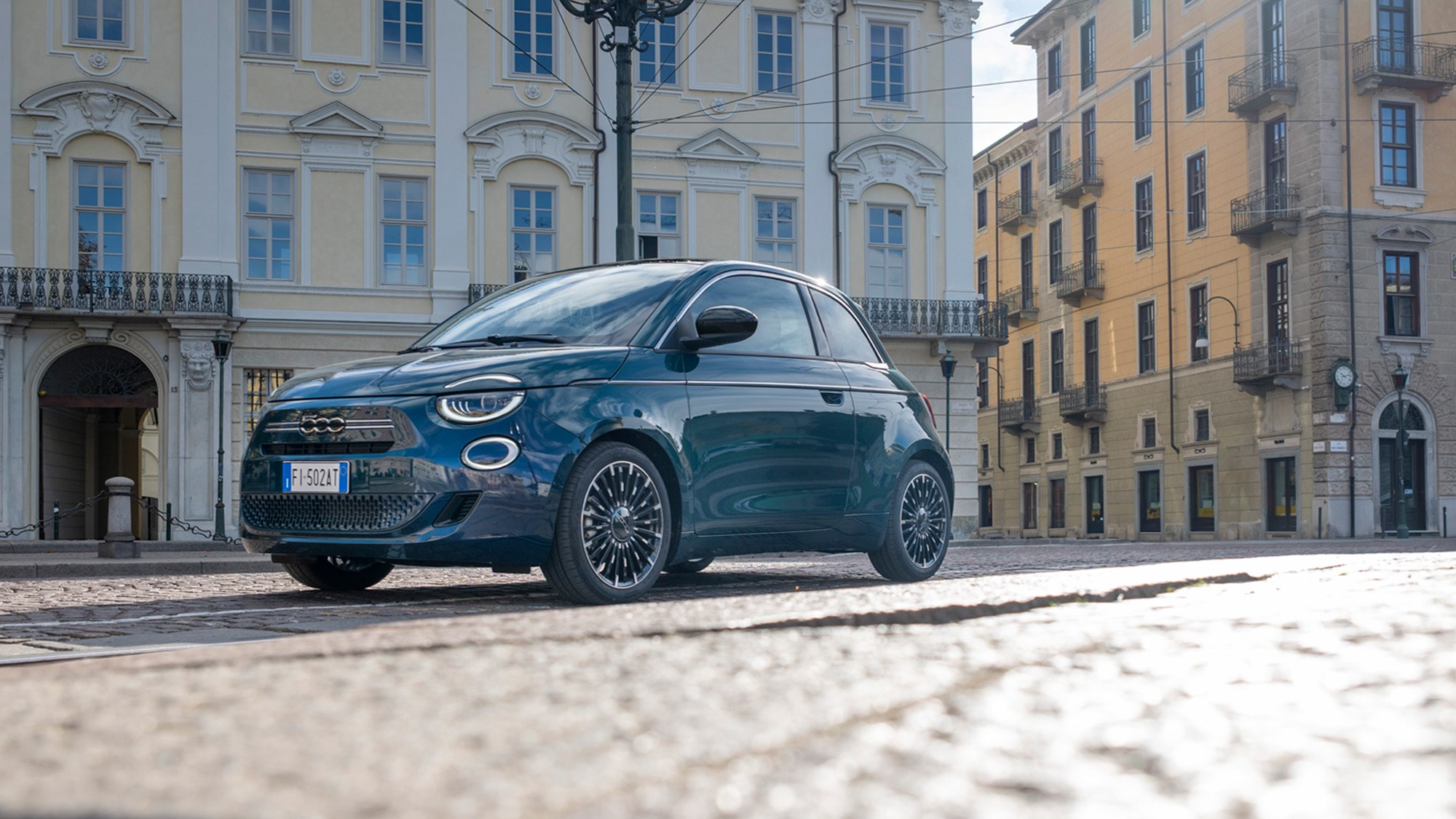 a blue Fiat 500 Hybrid Torino edition 2025 parked in the streets of Turin