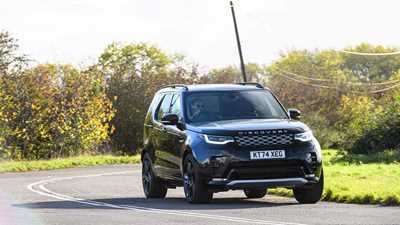 Land Rover Discover (2025) review: front three quarter cornering, black paint, wide angle