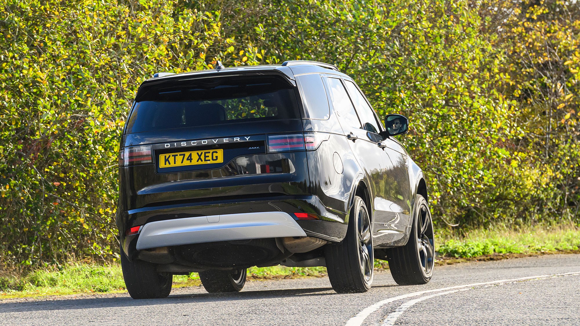Land Rover Discover (2025) review: rear three quarter cornering, black paint