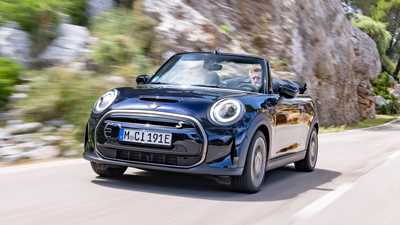 MINI Electric Convertible (2023): front three quarter driving, low angle, Mallorca road, black paint