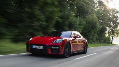 Porsche Panamera GTS: front three quarter driving, red paint, low angle