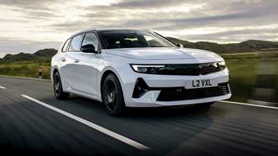 Vauxhall Astra Sports Tourer review - front, white, driving at sunset