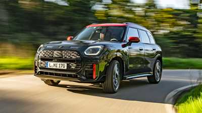 Mini Countryman JCW review - front view, black, driving round corner
